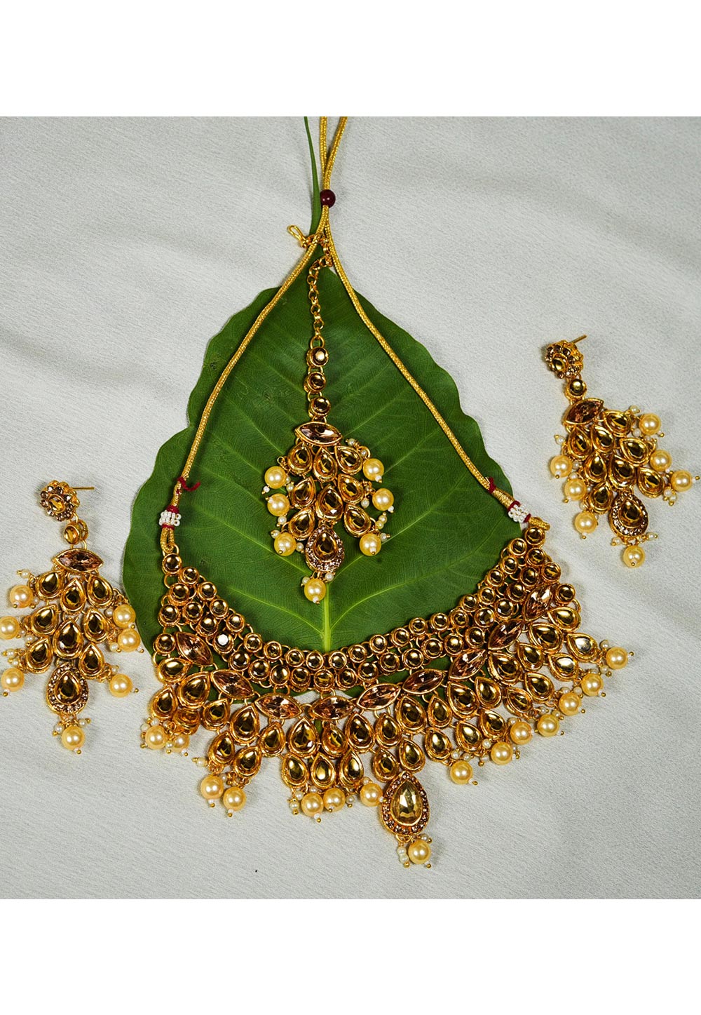 Golden Alloy Austrian Diamond Necklace Set With Earrings and Maang Tikka 247907