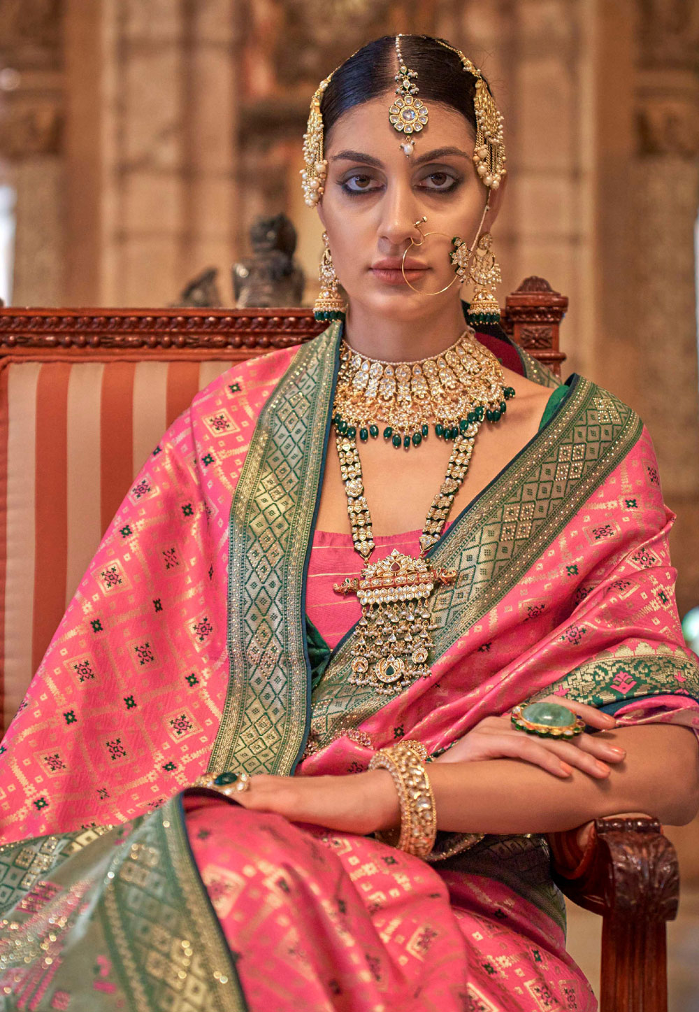 Beautiful Indian bride in traditional wedding outfit posing in front of  camera Stock Photo - Alamy