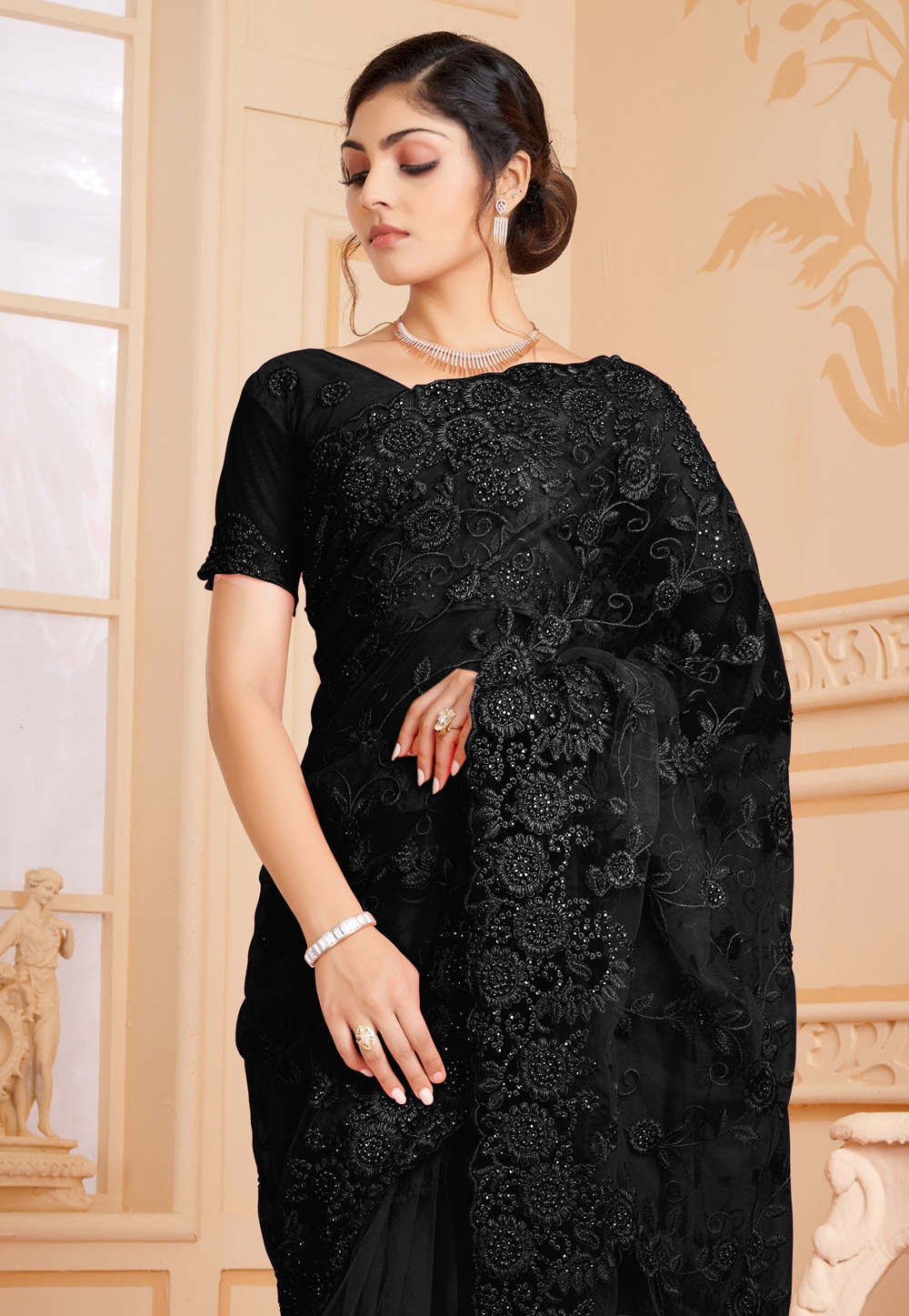 https://resources.indianclothstore.com/resources/productimages/156106122022-Black-Net-Saree-With-Blouse-1.jpg