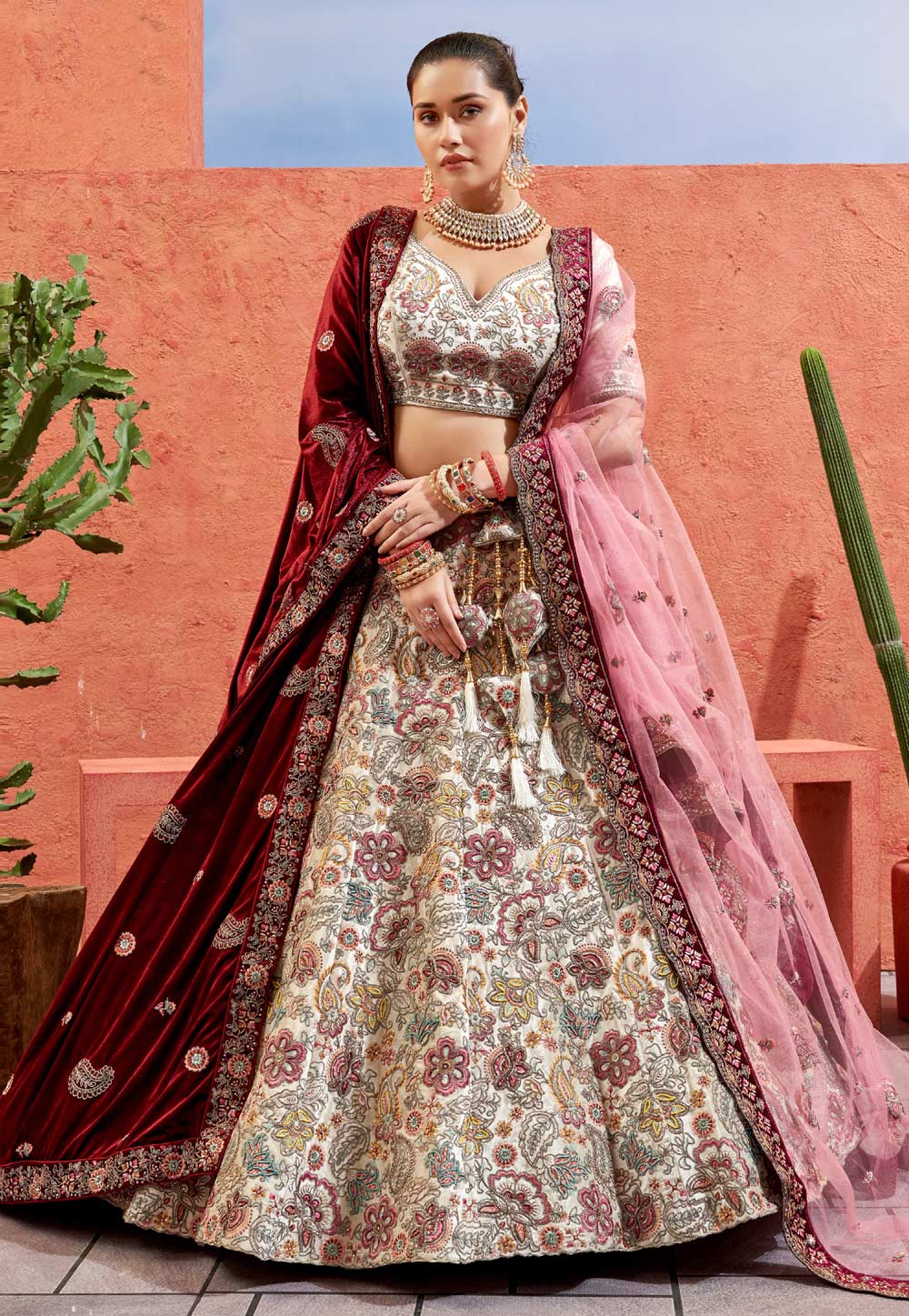 Photo of Red and white bridal lehenga with green jewellery
