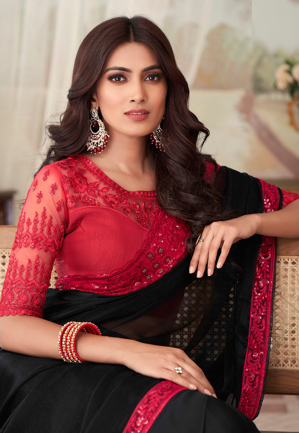 Photo of Black saree with a maroon velvet blouse.