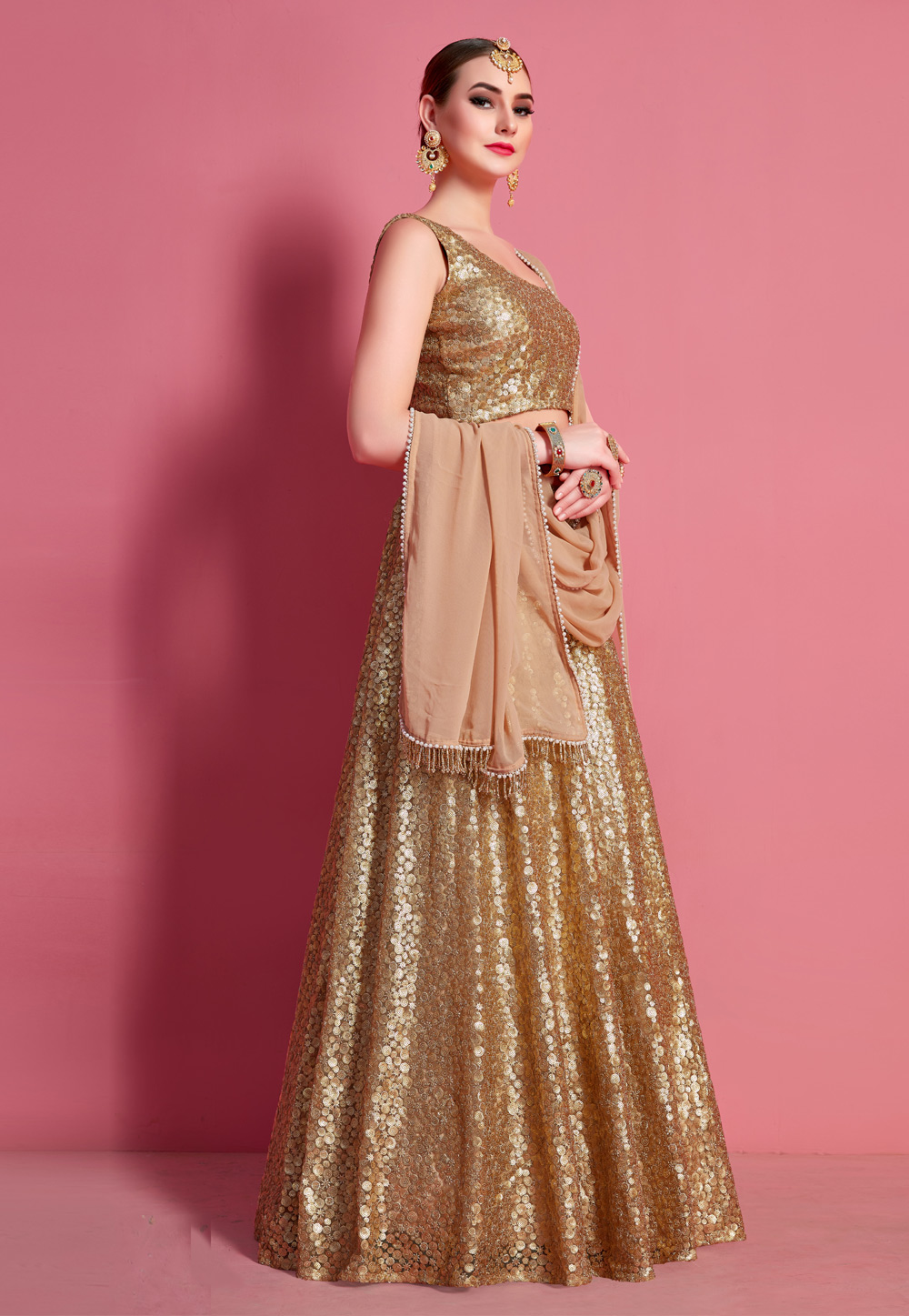 GOLDEN PEACH HEAVY EMBROIDERED DESIGNER LEHENGA – zarikaariindia.com