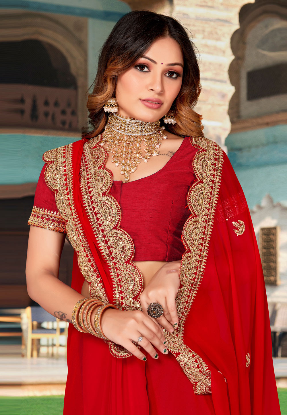 Photo of south indian red bridal saree with gold jewellery