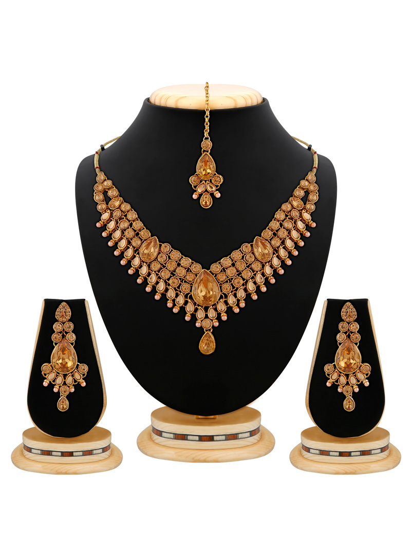 Golden Brass Kundan Set With Earrings and Maang Tikka  103925